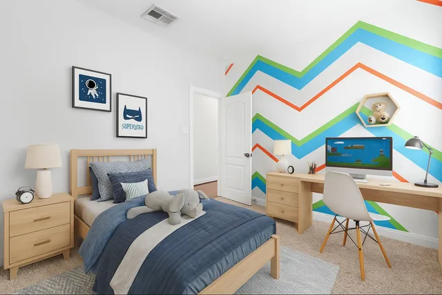 a bedroom with a bed and a workspace