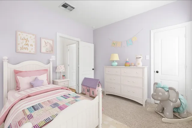 a bedroom with a bed and cabinets