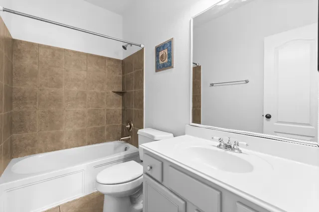 a bathroom with a sink a toilet and a bathtub