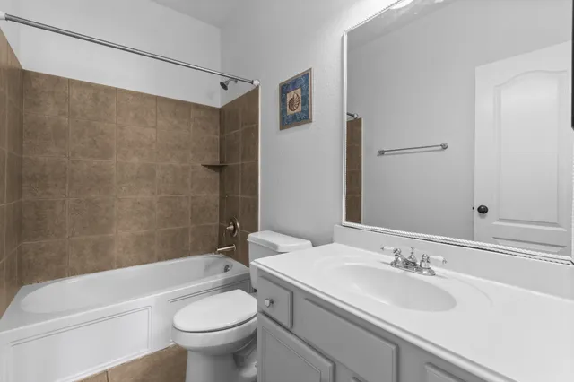 a bathroom with a sink a toilet and a bathtub