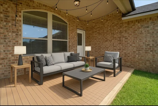 a view of a patio with couches and a dining table with garden view