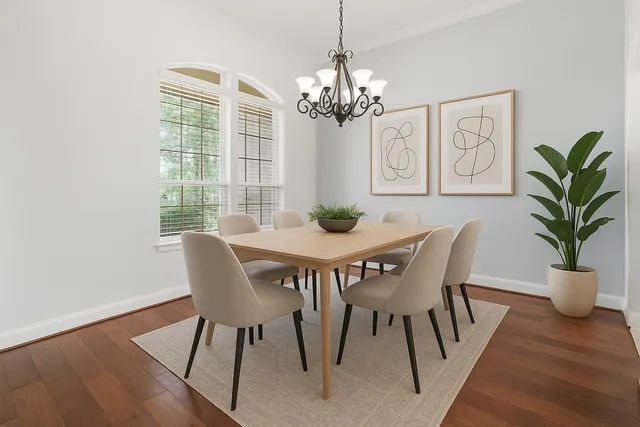 a view of a dining room with furniture wooden floor and chandelier