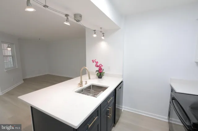 a bathroom with a sink vanity and a mirror