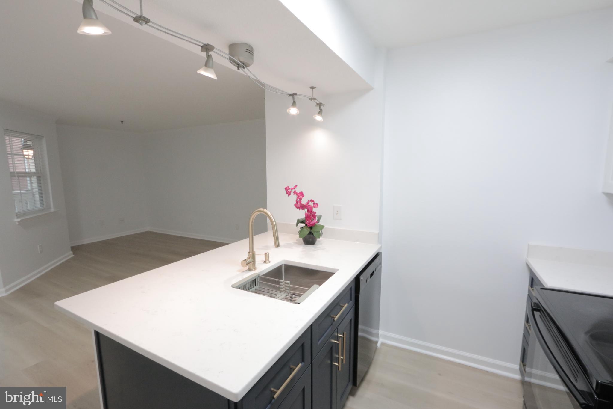 1504 Lincoln Way, Unit 104 McLean, VA 22102 - Photo 13 of 40 a bathroom with a sink vanity and a mirror