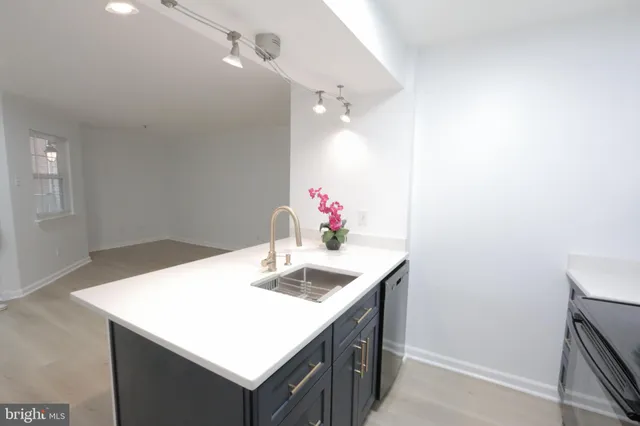 a bathroom with a sink vanity and a mirror