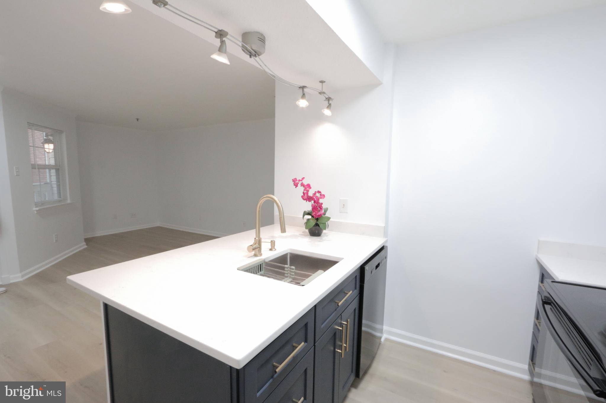 1504 Lincoln Way, Unit 104 McLean, VA 22102 - Photo 14 of 40 a bathroom with a sink vanity and a mirror