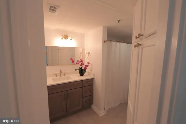 a bathroom with a sink and mirror