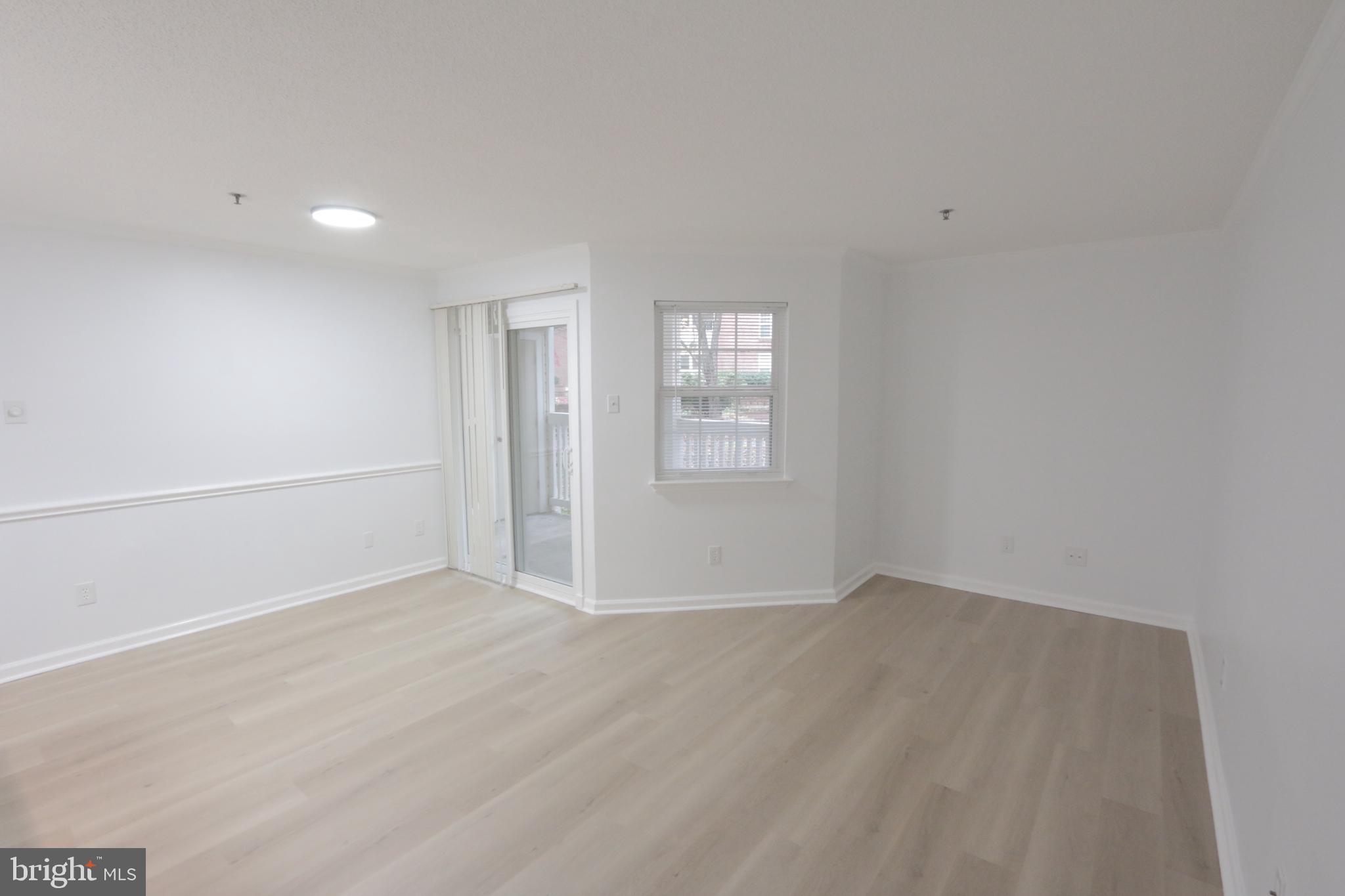 1504 Lincoln Way, Unit 104 McLean, VA 22102 - Photo 2 of 40 an empty room with windows and closet