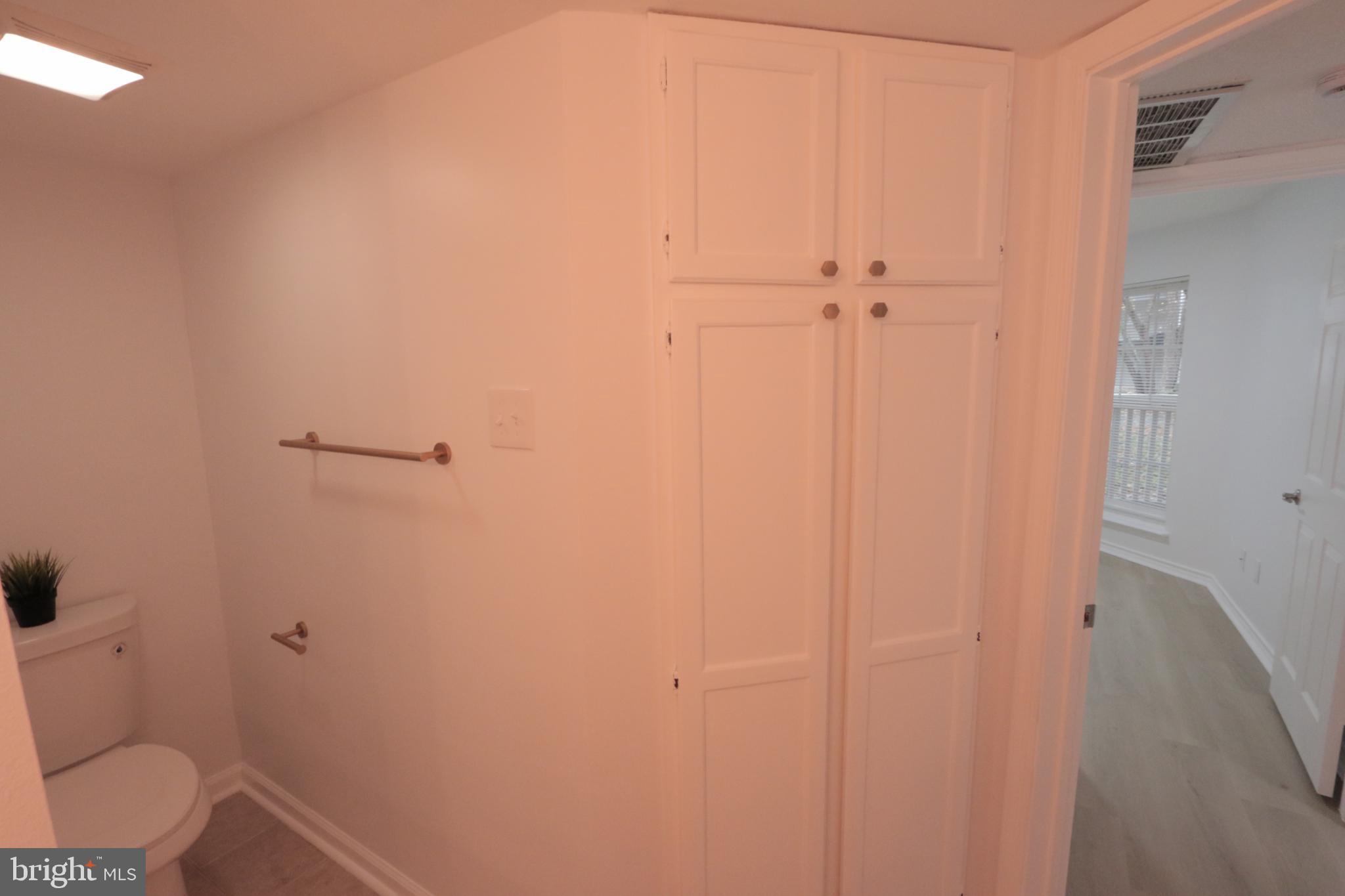 1504 Lincoln Way, Unit 104 McLean, VA 22102 - Photo 23 of 40 a bathroom with a toilet and a shower