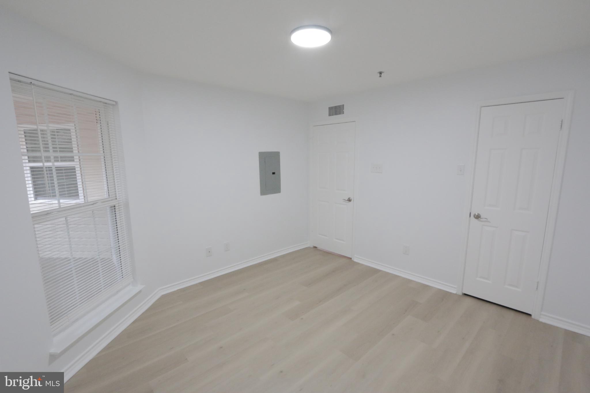 1504 Lincoln Way, Unit 104 McLean, VA 22102 - Photo 25 of 40 an empty room with windows