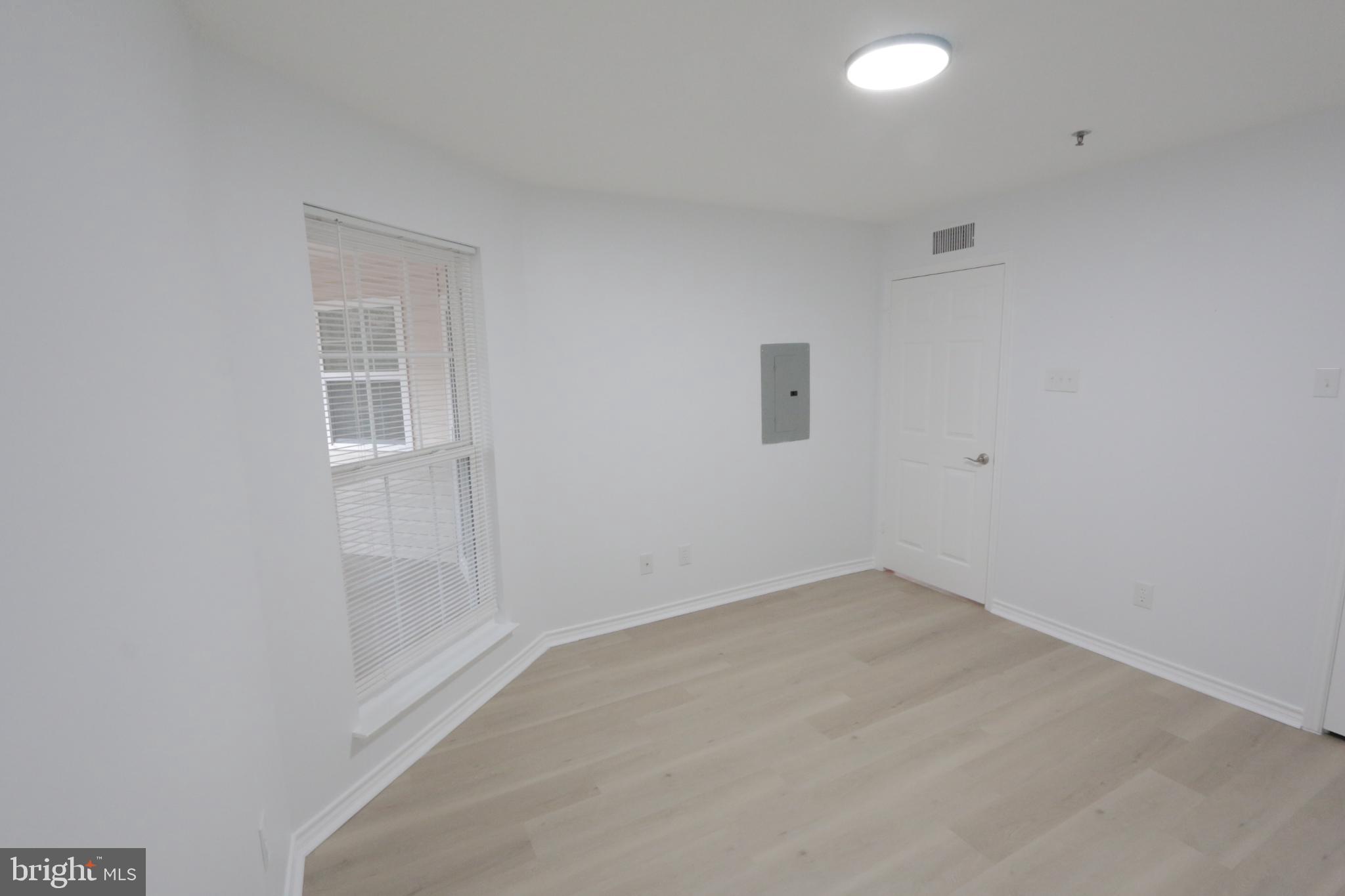 1504 Lincoln Way, Unit 104 McLean, VA 22102 - Photo 26 of 40 an empty room with a empty space and windows