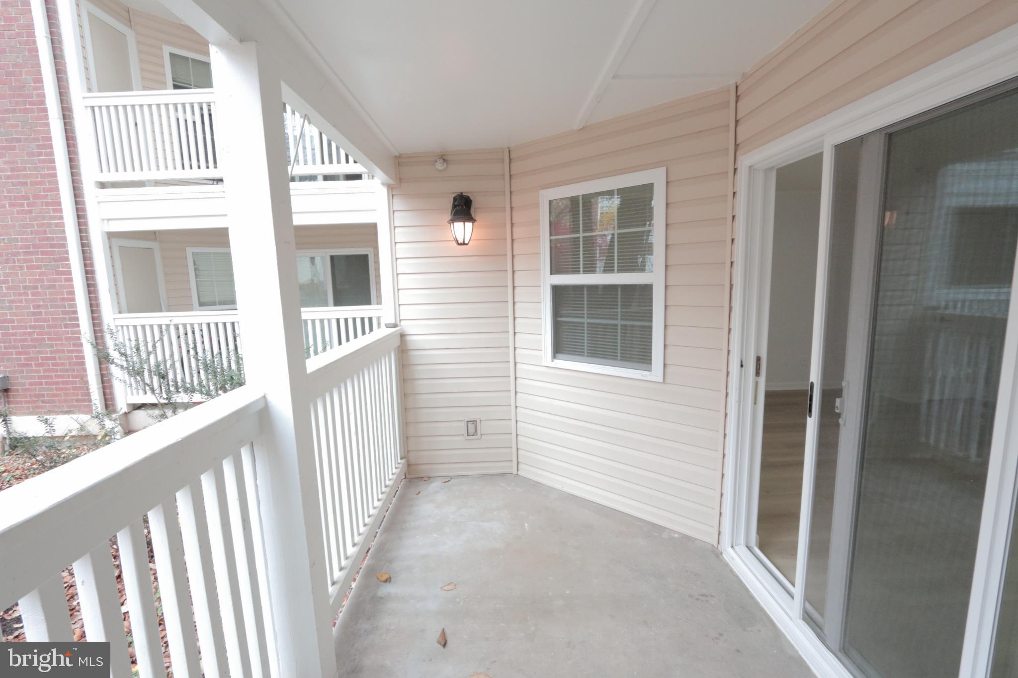1504 Lincoln Way, Unit 104 McLean, VA 22102 - Photo 32 of 40 a view of a house with wooden fence and windows