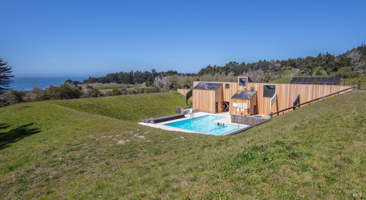 481 Drovers Close The Sea Ranch, CA 95497 - Photo 14 of 15 a view of a swimming pool and a yard