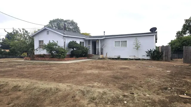 a house view with a outdoor space
