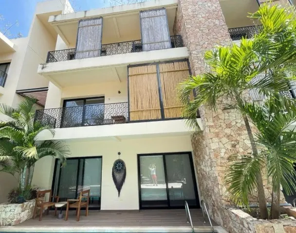 a front view of a house with garage