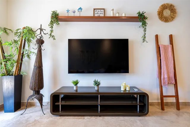 a living room with furniture and a flat screen tv