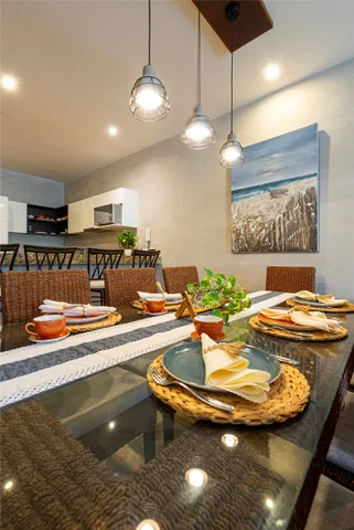 a view of a dining room and kitchen with furniture and window
