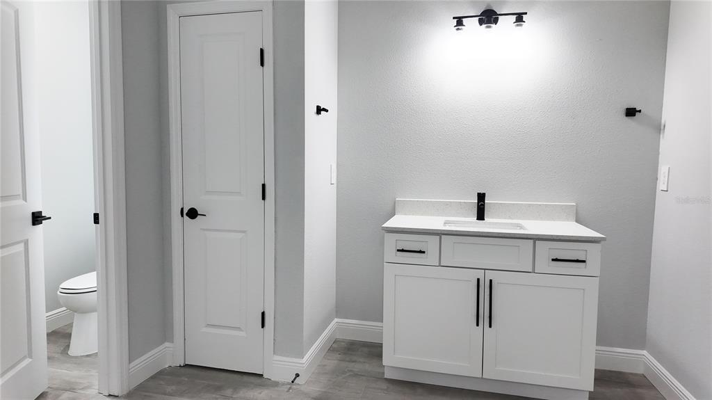 7 Spring Pass Ocala, FL 34472 - Photo 15 of 35 a bathroom with a sink toilet and vanity