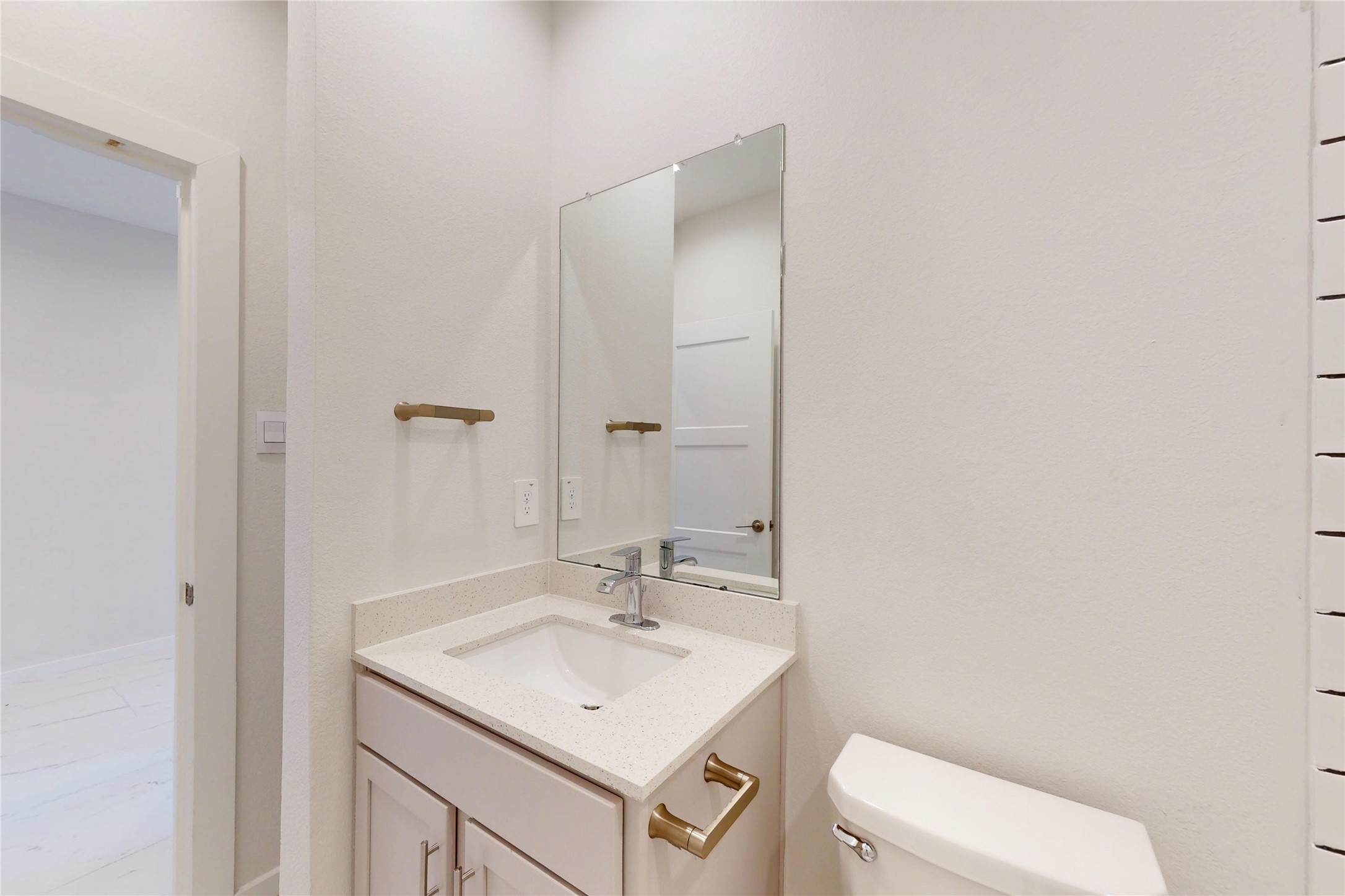 10428 Great Basin Lane Conroe, TX 77384 - Photo 14 of 28 a bathroom with a sink toilet and a mirror