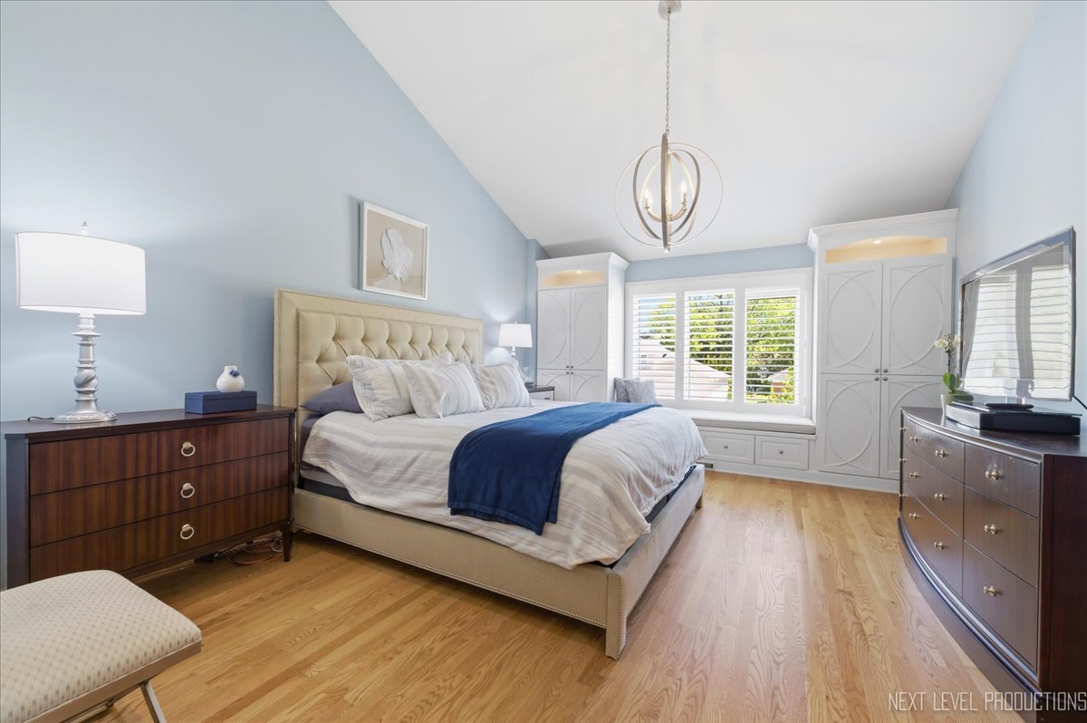 1914 North Ridge Avenue Arlington Heights, IL 60004 - Photo 20 of 50 a bedroom with a bed dresser and wooden floor