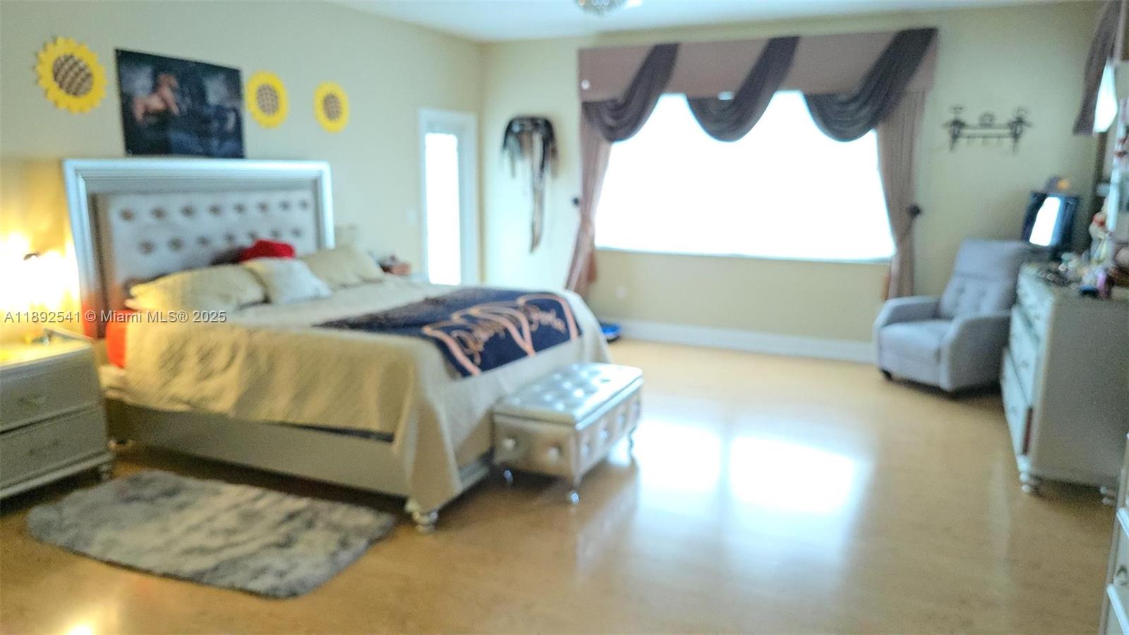 15982 Southwest 61st Street Davie, FL 33331 - Photo 15 of 28 a bedroom with a bed and a couch