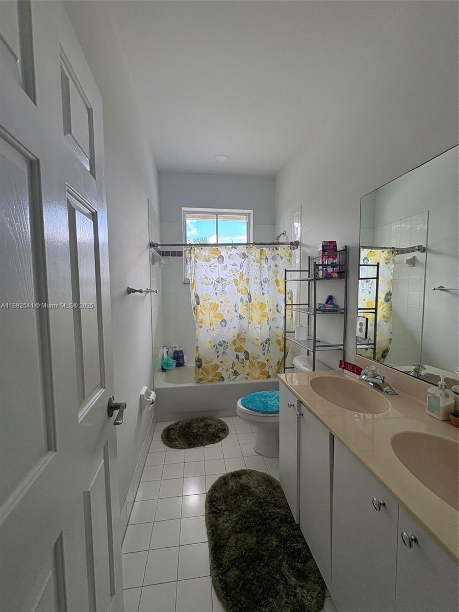 15982 Southwest 61st Street Davie, FL 33331 - Photo 20 of 28 a bathroom with a sink toilet and shower