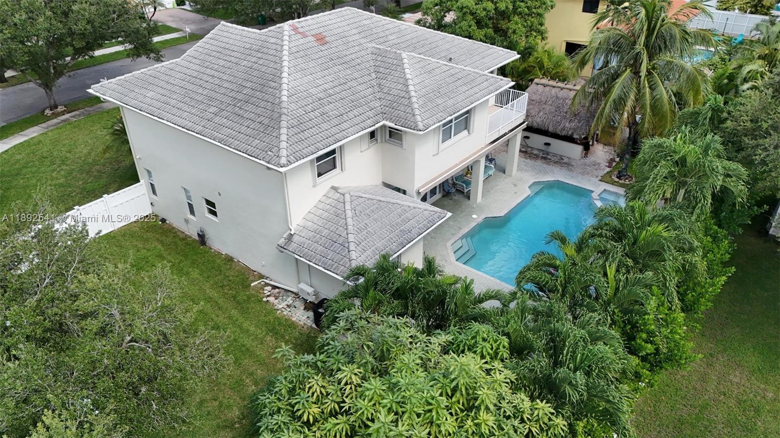 15982 Southwest 61st Street Davie, FL 33331 - Photo 2 of 28 an aerial view of a house with a yard and trees