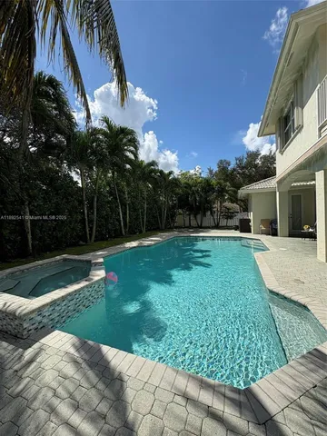 a view of a yard and front view of a house