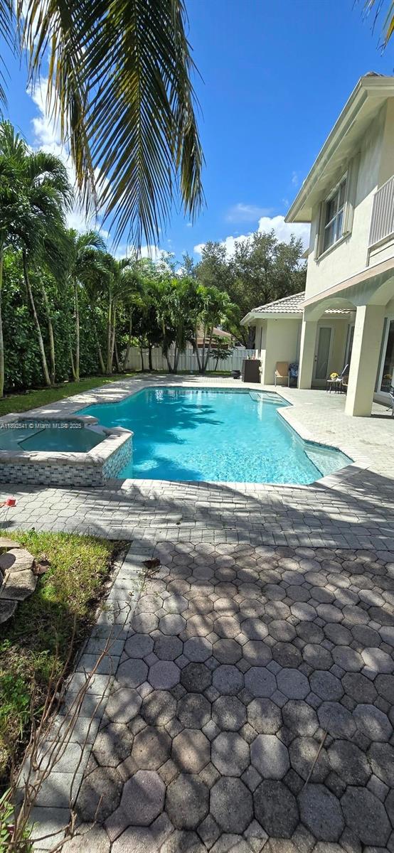15982 Southwest 61st Street Davie, FL 33331 - Photo 26 of 28 a view of a yard and front view of a house
