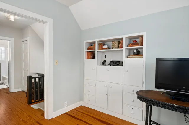 a room with furniture and wooden floor