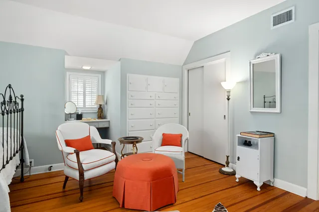 a room with furniture and wooden floor