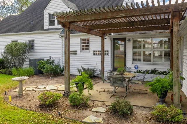 a backyard of a house with outdoor seating