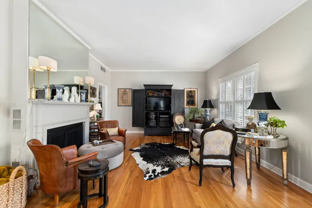 a living room with furniture fireplace and window
