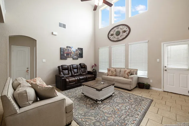 a living room with furniture and a table