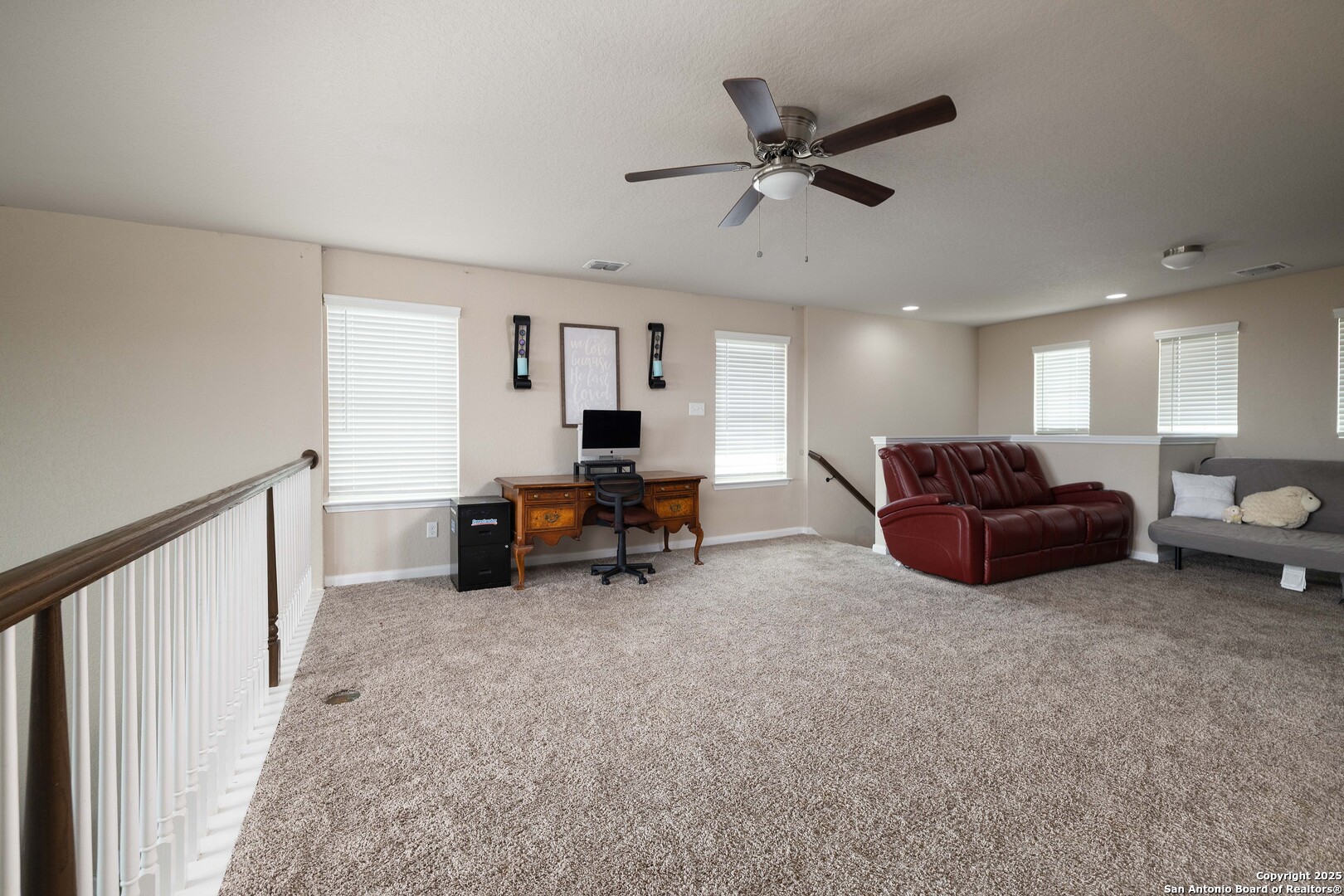 10238 Midsummer Meadow Converse, TX 78109 - Photo 20 of 35 a living room with furniture and a ceiling fan