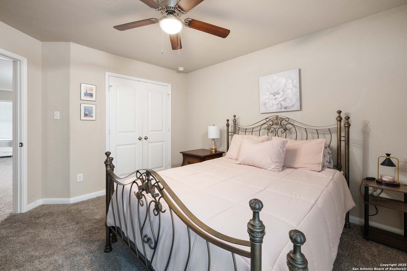 10238 Midsummer Meadow Converse, TX 78109 - Photo 23 of 35 a bedroom with a bed and a chandelier