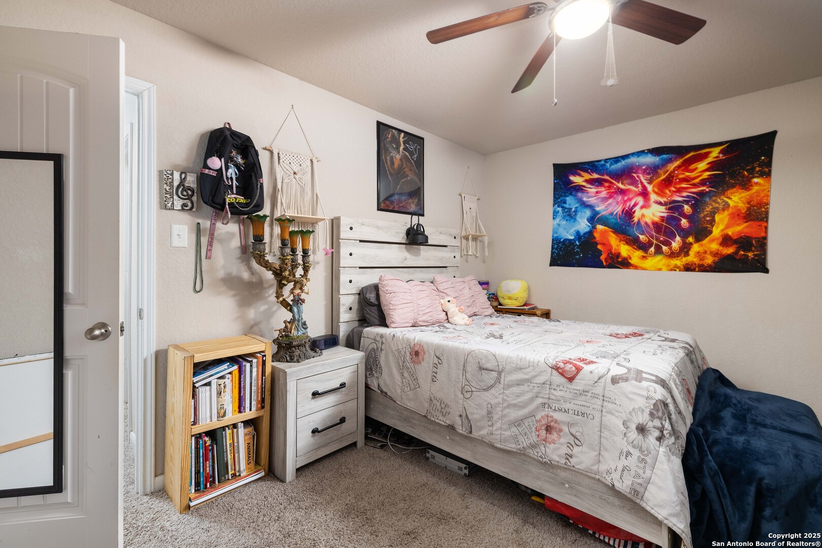 10238 Midsummer Meadow Converse, TX 78109 - Photo 26 of 35 a bedroom with a bed and a painting on the wall