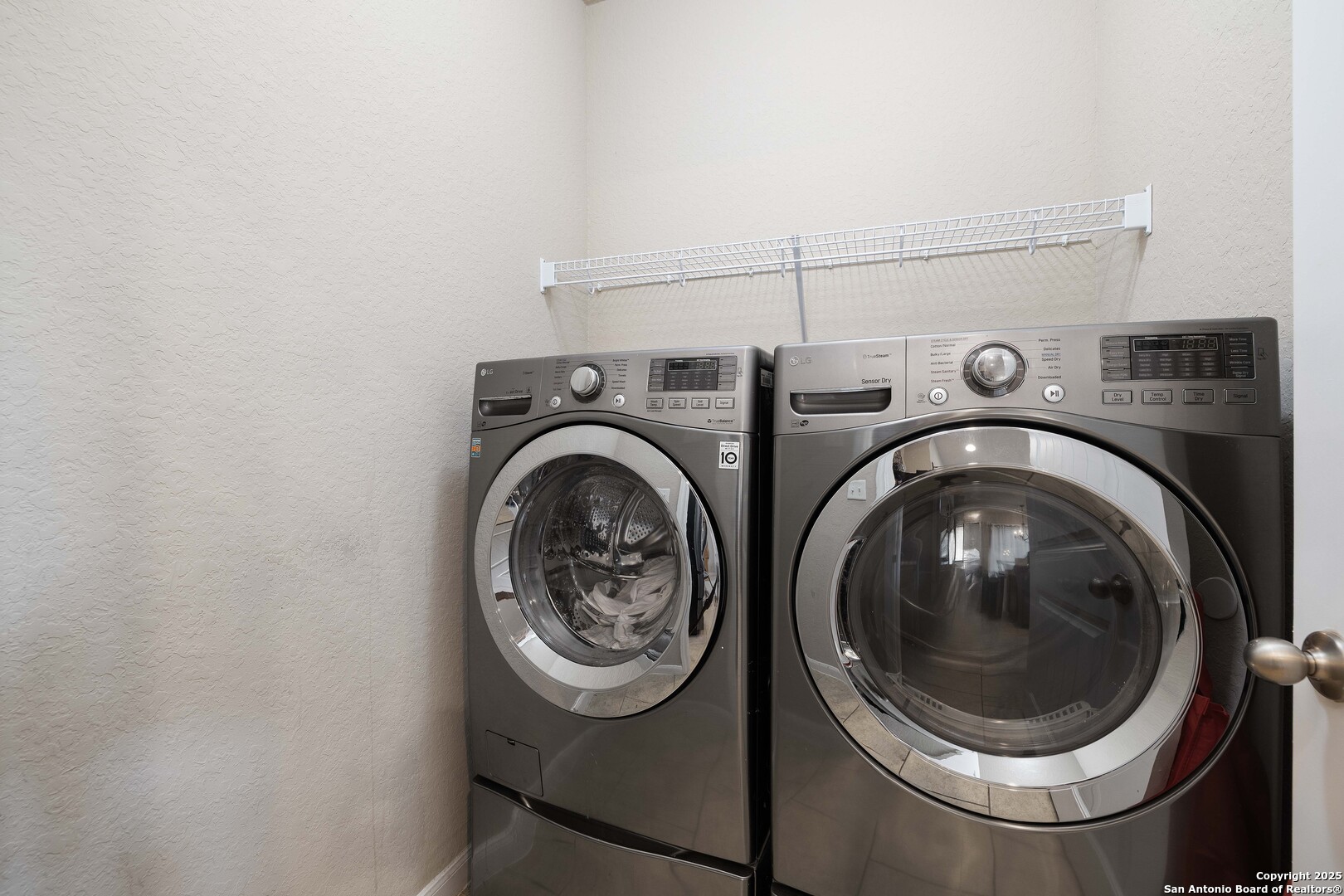 10238 Midsummer Meadow Converse, TX 78109 - Photo 28 of 35 a close up view of a washer and dryer