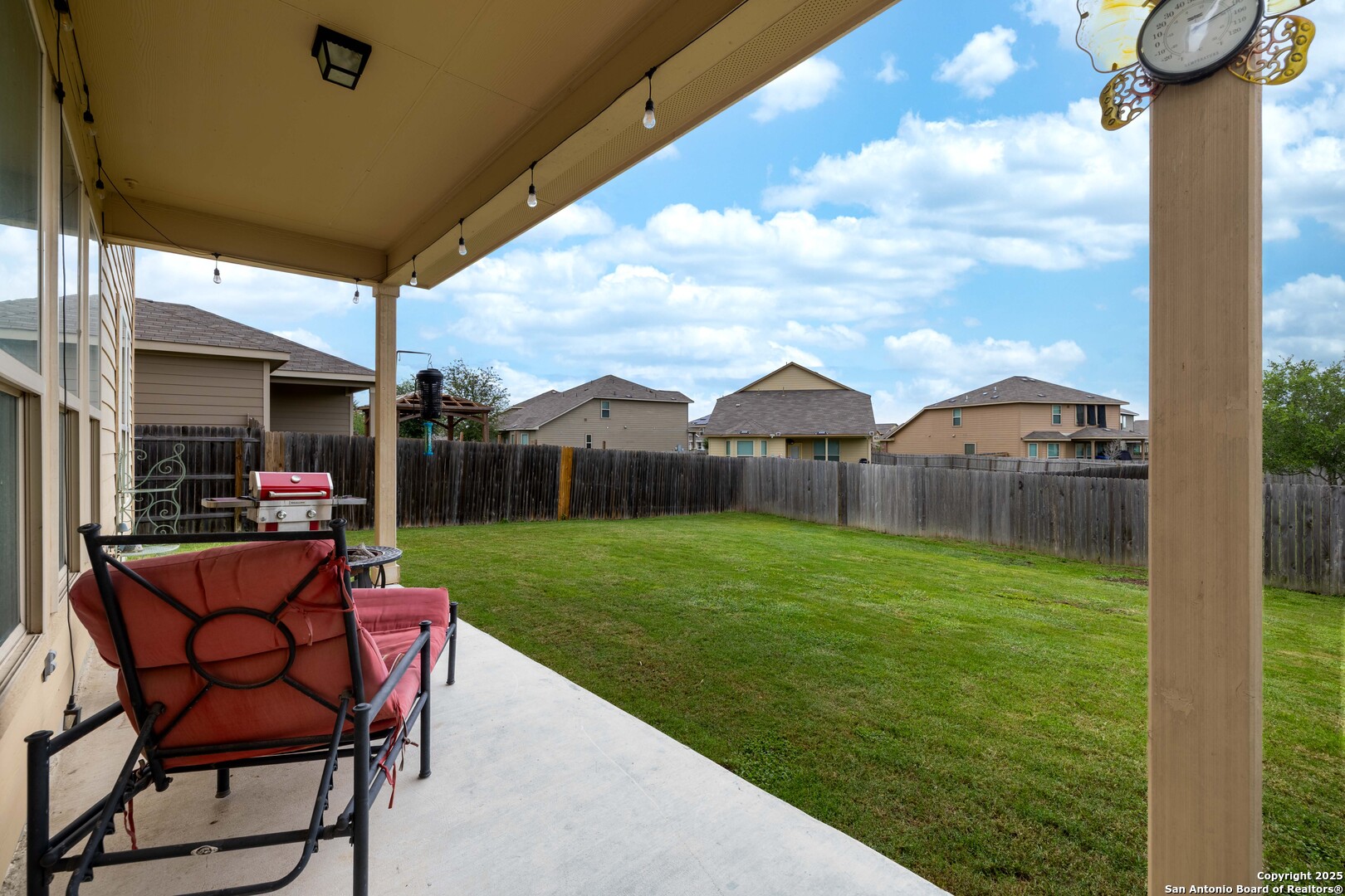 10238 Midsummer Meadow Converse, TX 78109 - Photo 31 of 35 a view of a chair and table in backyard of the house