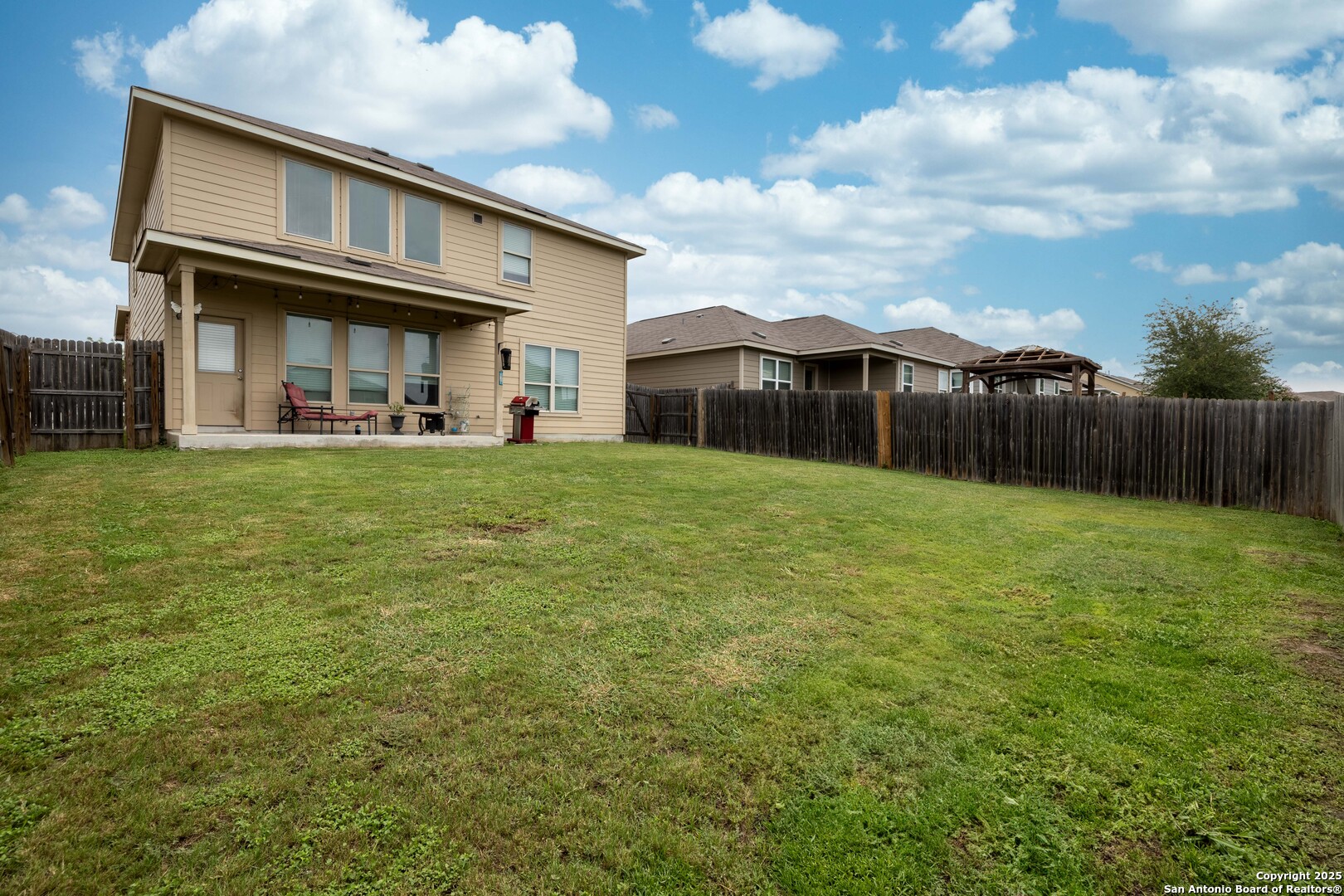 10238 Midsummer Meadow Converse, TX 78109 - Photo 33 of 35 a view of a house with a yard and sitting area