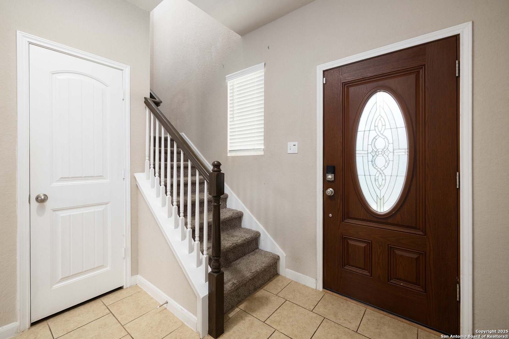 10238 Midsummer Meadow Converse, TX 78109 - Photo 4 of 35 a view of a hallway with entryway wooden floor and a livingroom