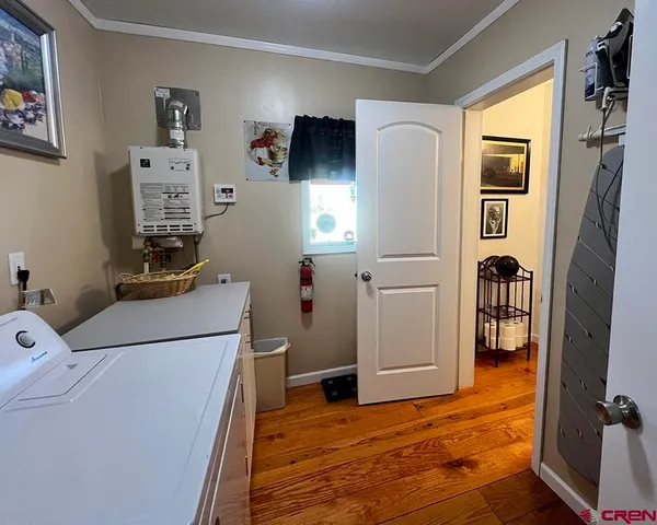 a view of a livingroom with furniture and a window