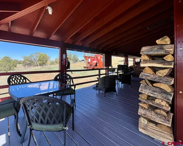 a view of a chairs and dinning table in patio