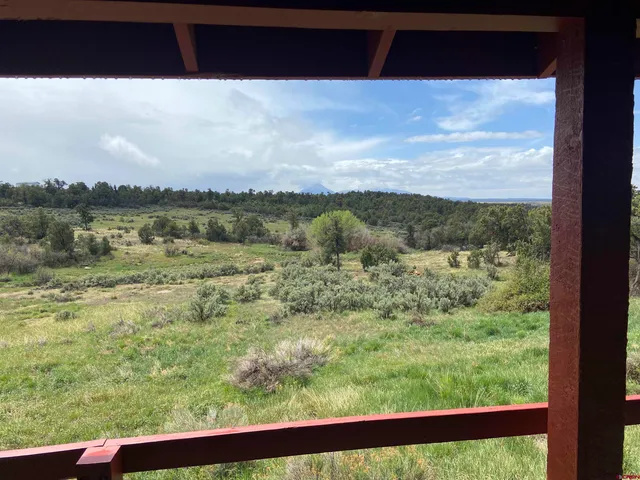 a view of a lake from a balcony