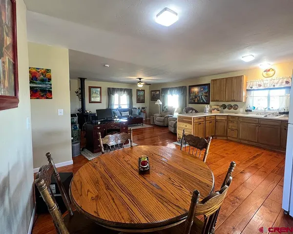 a dining room with furniture and window