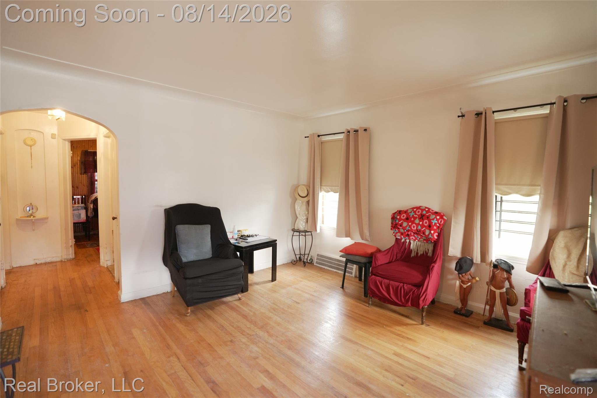 9557 Meyers Road Detroit, MI 48227 - Photo 9 of 23 Hardwood flooring, arched doorway, and multiple windows