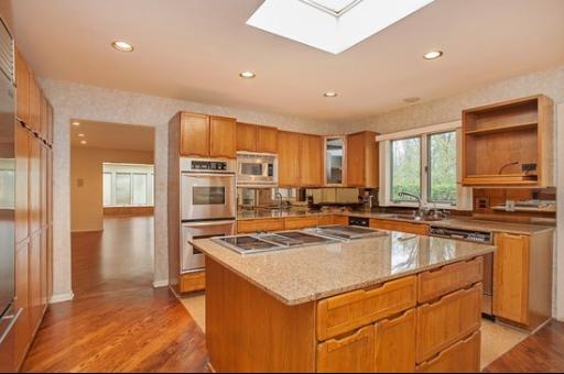 804 North Happ Road Northfield, IL 60093 - Photo 6 of 13 a kitchen with stainless steel appliances granite countertop a sink stove and refrigerator
