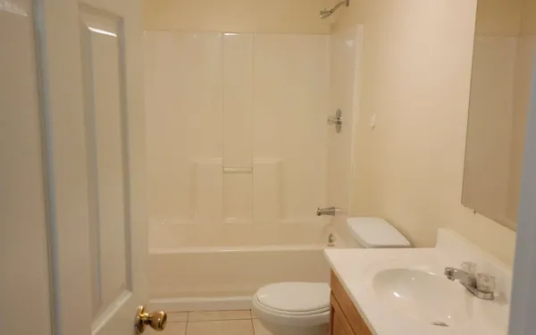 a kitchen with a refrigerator and cabinets