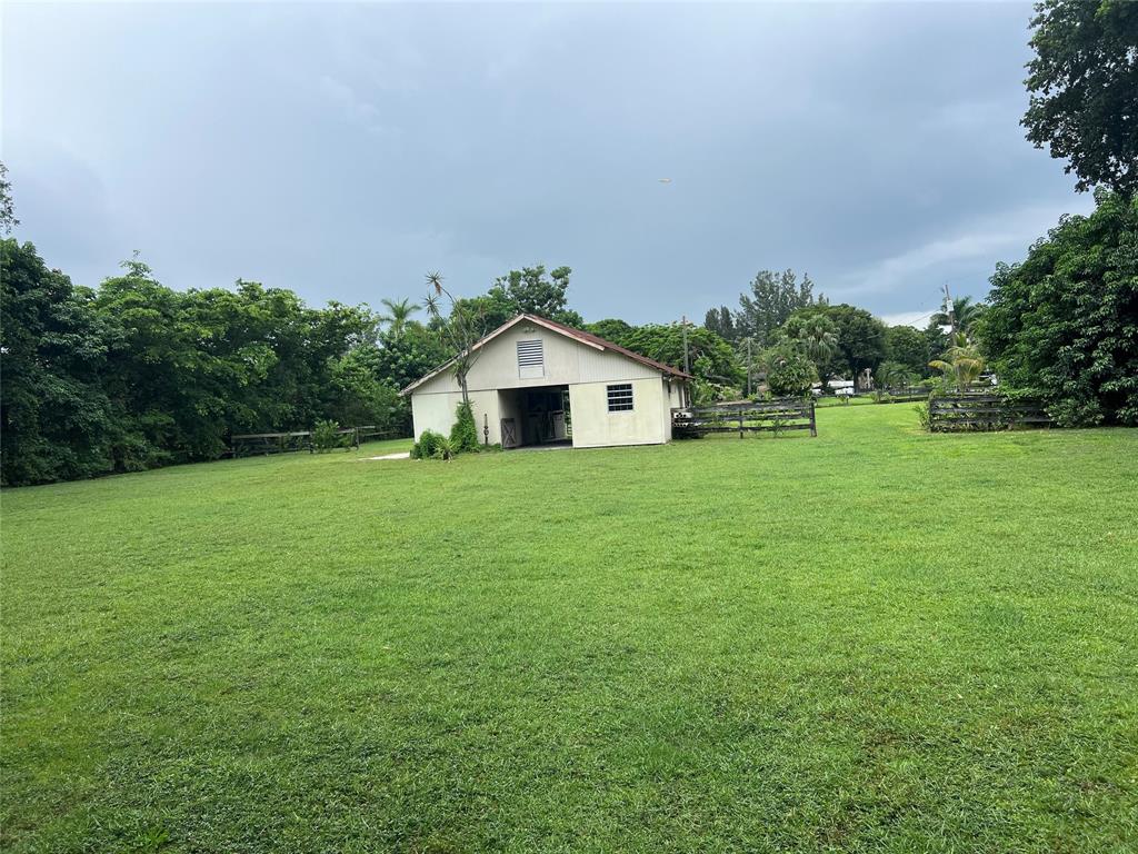 1765-back Lot Southwest 112th Avenue Davie, FL 33325 - Photo 18 of 19 a house with a garden