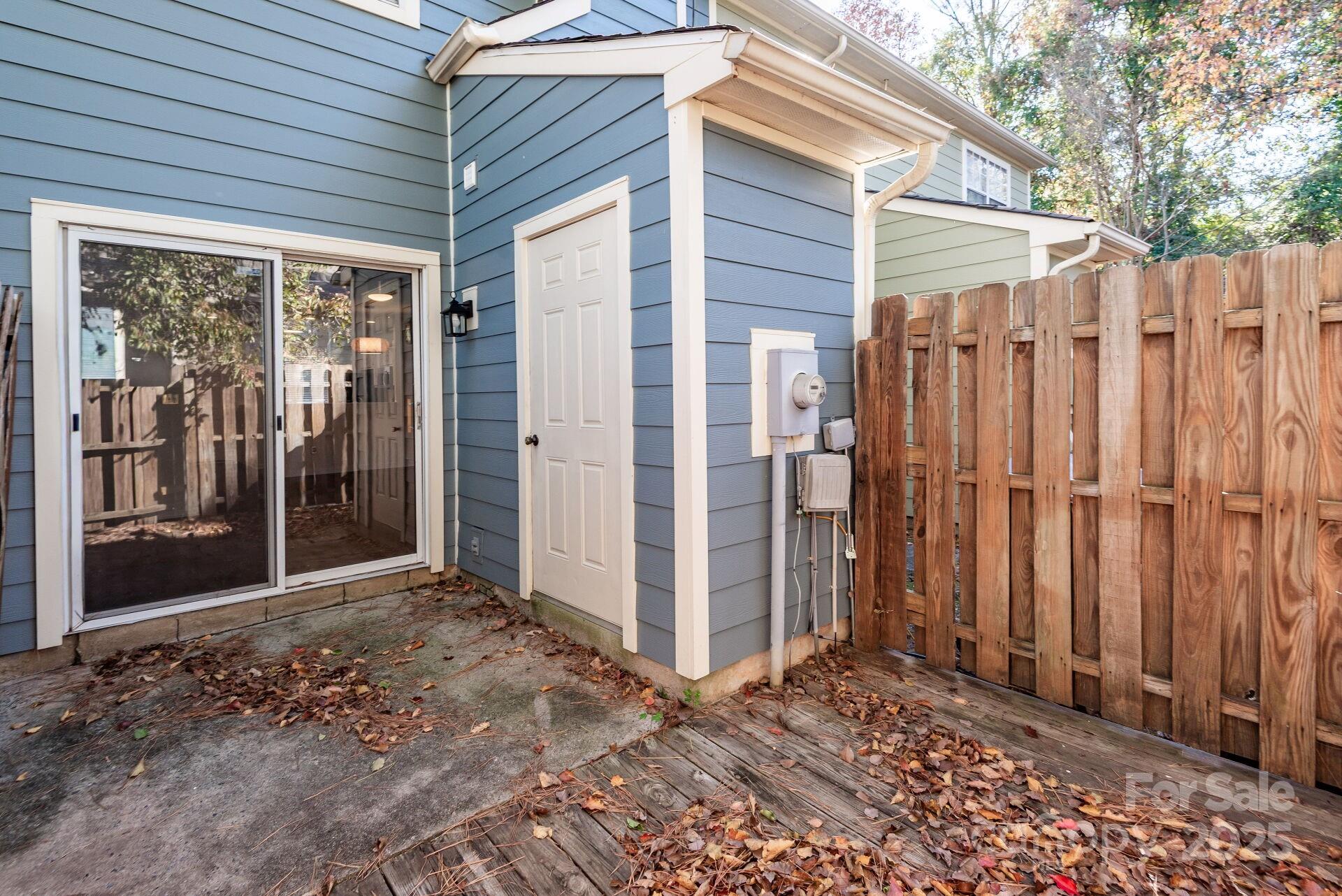 9204 4 Mile Creek Road Charlotte, NC 28277 - Photo 17 of 18 a view of a backyard with wooden fence